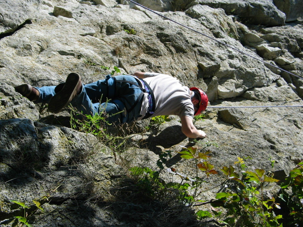 Climber scaling cliff at Mount Nemo Conservation Area